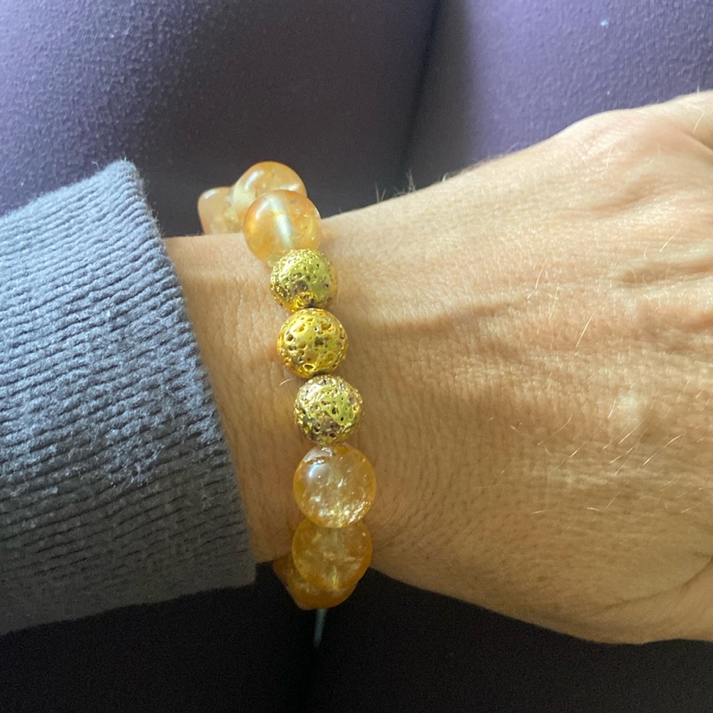 Genuine 12mm citrine gemstone bracelet with gold plated lava.